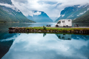 Family vacation travel RV, holiday trip in motorhome, Caravan car Vacation. Beautiful Nature Norway natural landscape.